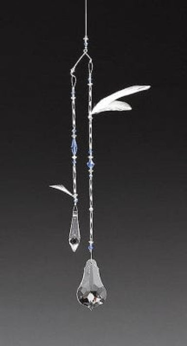 Decorative hanging ornament with crystal elements on a black background