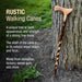 Rustic walking cane leaning against a tree with descriptive text about its features.