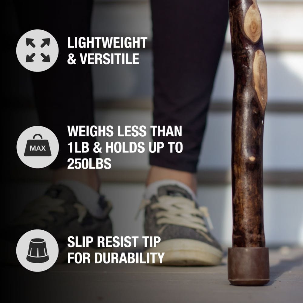 Wooden walking stick with text highlighting features on a blurred background