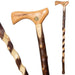 Three wooden walking sticks with different designs on a white background