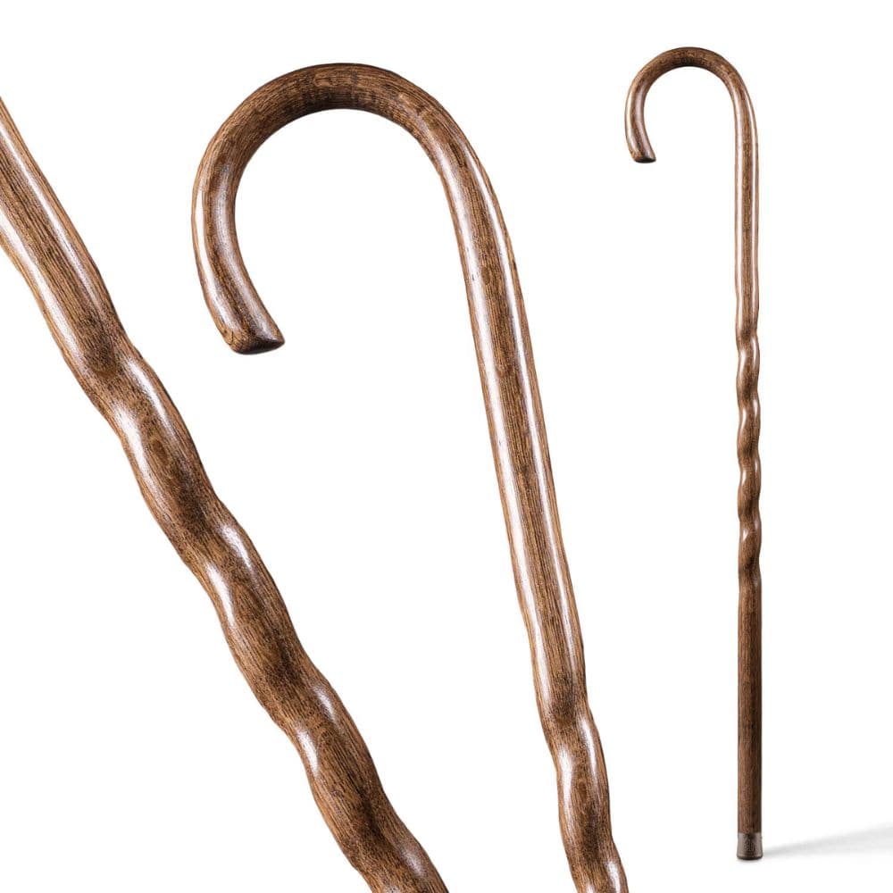 Two wooden walking canes on a white background