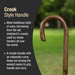 Wooden crook-style handle cane with text explaining its traditional design.
