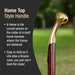 Cane with gold top handle on a blurred green background