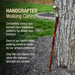 Handcrafted walking cane leaning against a tree with promotional text about the product.