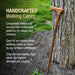 Handcrafted walking cane leaning against a tree with promotional text about its traditional craftsmanship.