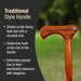 Wooden handle with rounded end and distinctive hook, set against a blurred green background.