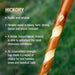 Hickory stick with text about its properties on a blurred green background