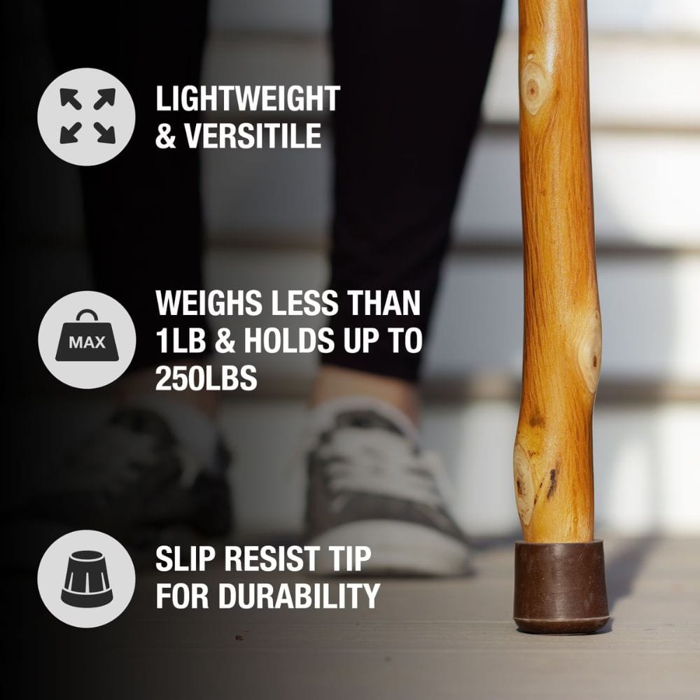 Wooden walking stick with text highlighting features on a blurred background