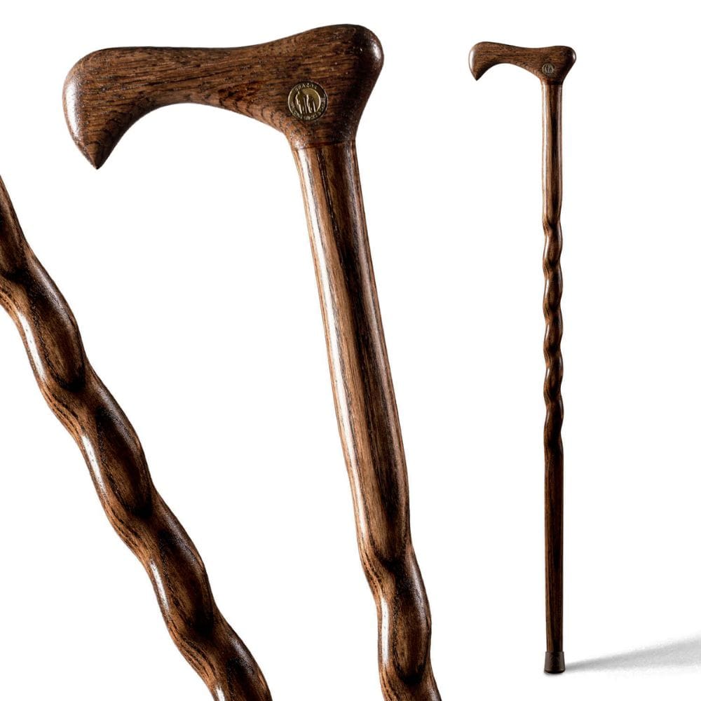 Wooden walking cane with a detailed handle on a white background