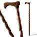 Wooden walking cane with a detailed handle on a white background