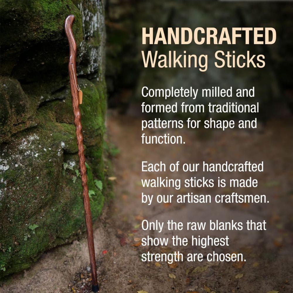 Handcrafted walking stick leaning against a stone wall with promotional text about traditional patterns and artisan craftsmanship.