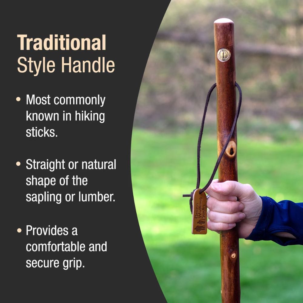 Hand holding a wooden hiking stick with text about traditional style handles.