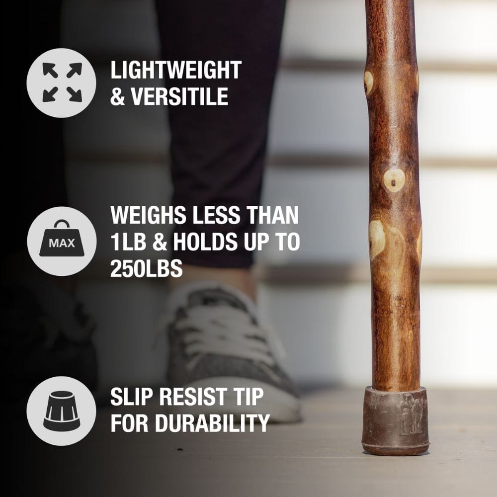 Wooden walking stick with text highlighting its features on a blurred background