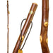 Three wooden walking sticks with decorative elements on a white background