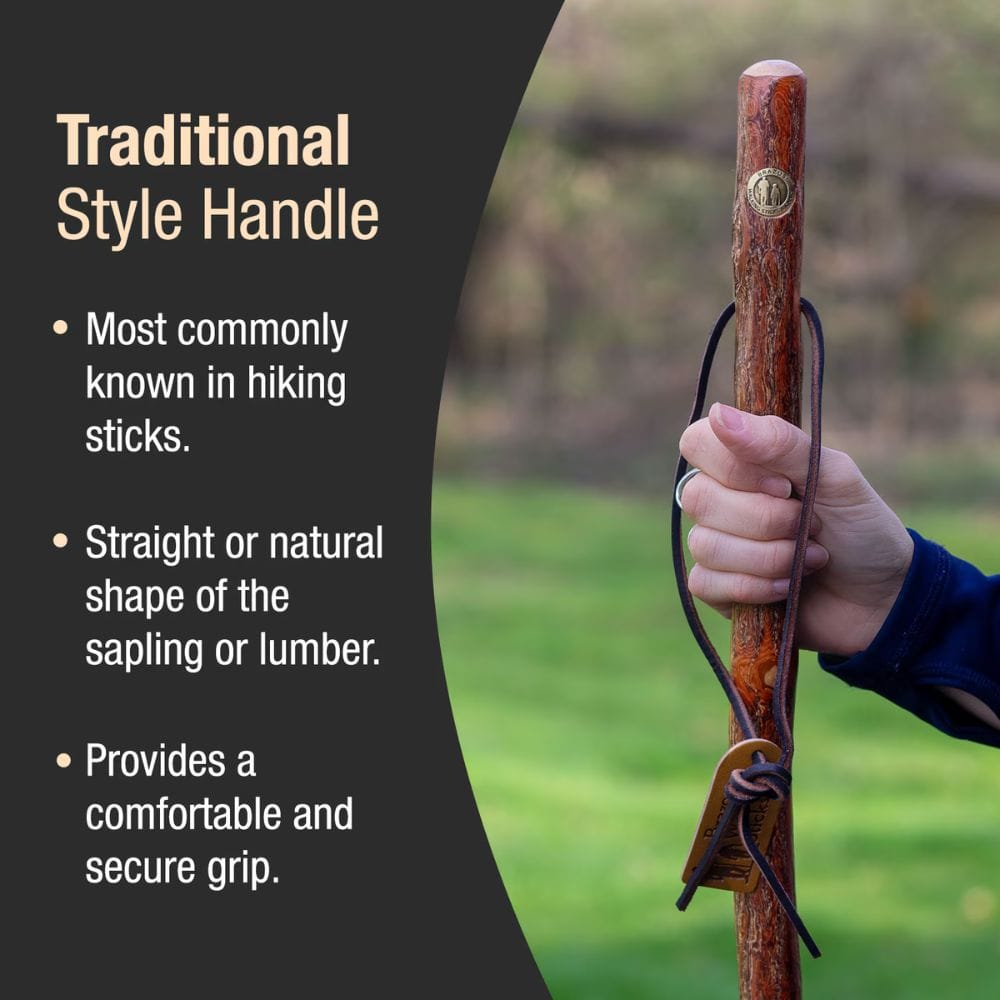 Wooden hiking stick held by a hand with text describing traditional style handles.