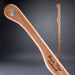 Wooden tool with engraved text on a gray background
