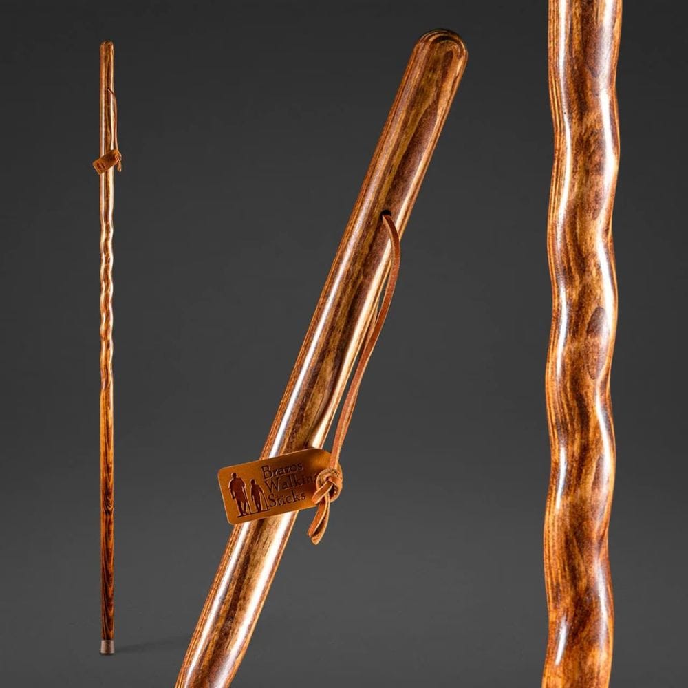 Wooden walking stick with a brand tag on a dark gray background