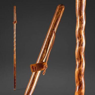Wooden walking stick with a brand tag on a dark gray background