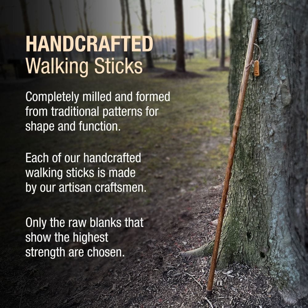 Handcrafted walking stick leaning against a tree with promotional text about its craftsmanship.