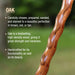 Wooden stick with text about oak wood properties on a blurred natural background
