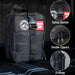 Black tactical first aid kit with safety buckle, double zippers, and D-rings on a dark background.