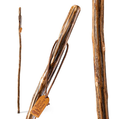 Wooden walking stick with a label on a white background