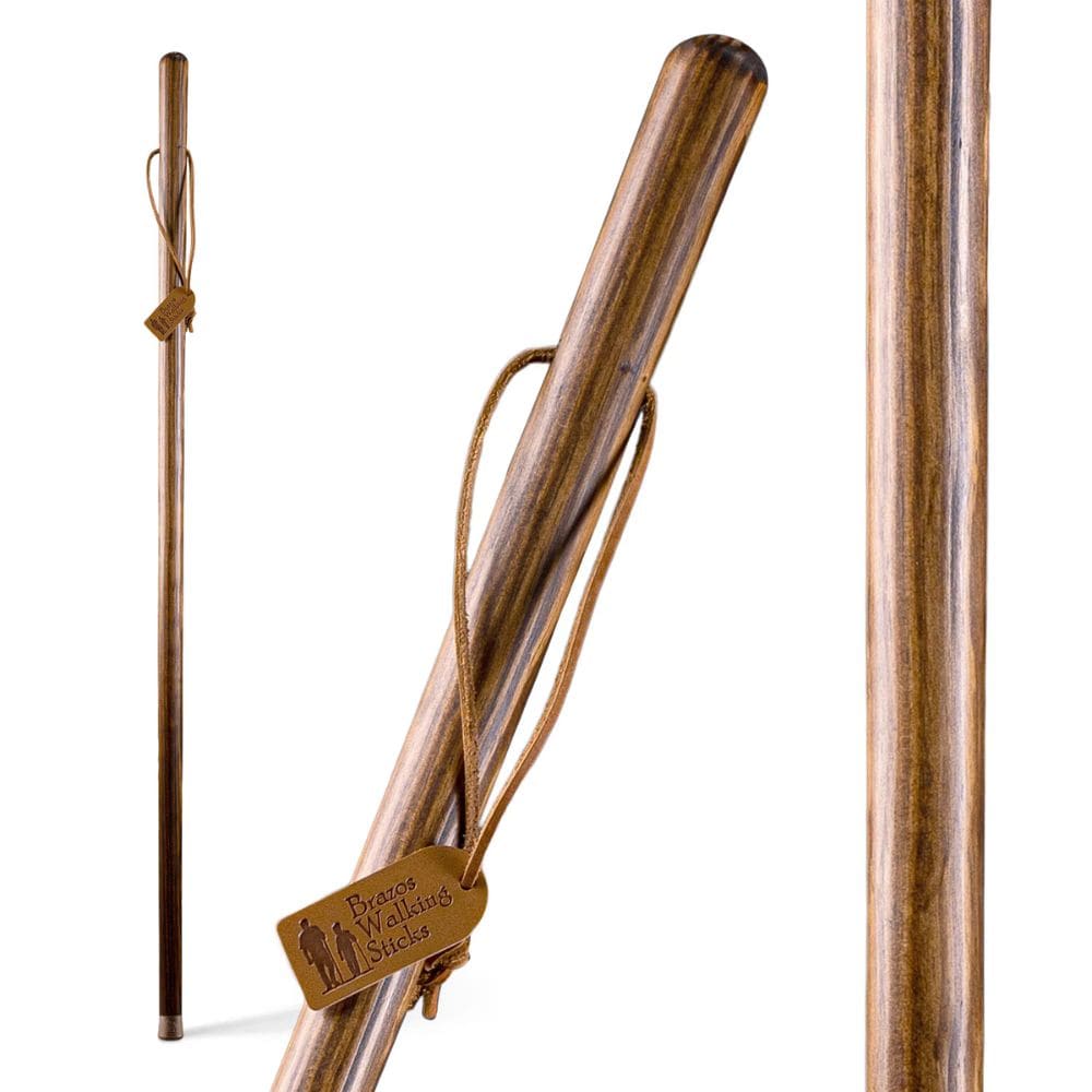 Wooden walking stick with carrying strap on a white background