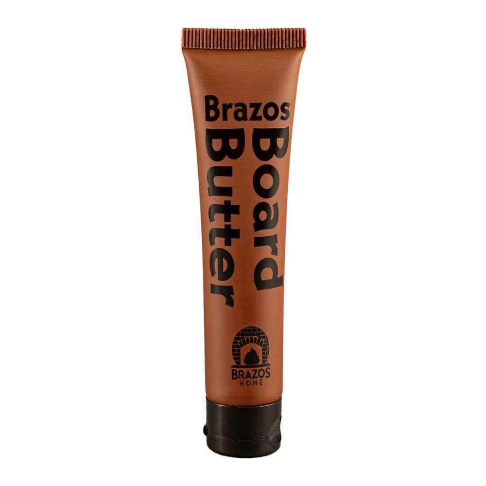 Brown tube of Brazos Board Butter on a white background