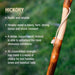 Hickory wood stick with text about its properties on a blurred green background