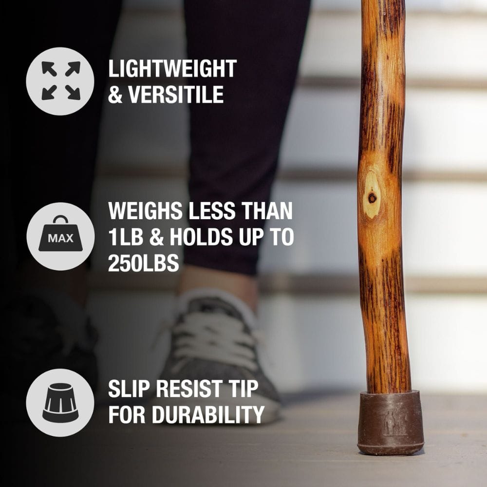 Wooden walking stick with text highlighting features on a blurred background