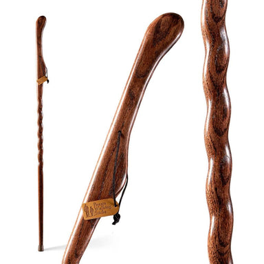 Wooden walking stick with a wavy handle on a white background