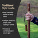 Hand holding a walking stick with text about traditional style handles