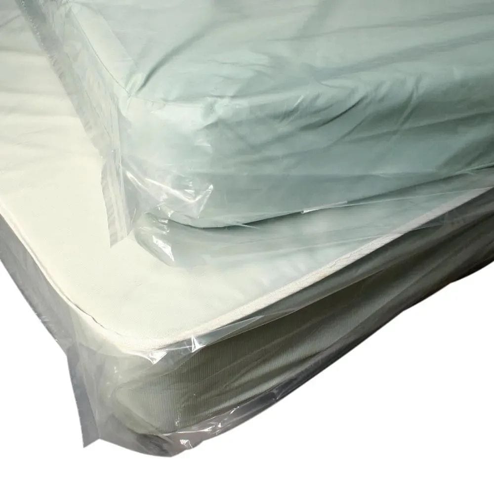 Mattress in a clear plastic wrap on a white background