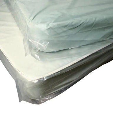 Mattress in a clear plastic wrap on a white background