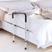 Bed rail attached to a bed in a bedroom setting
