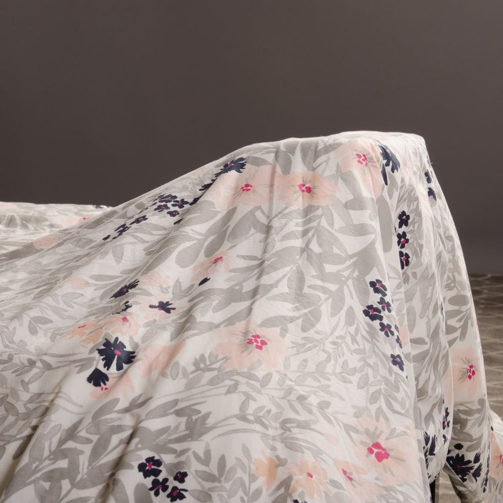 Floral patterned fabric draped over a surface with a dark background