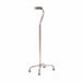 Metal walking cane with four-legged base on a white background