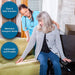 Woman assisting another woman in a wheelchair with transfers, highlighting ease and safety.