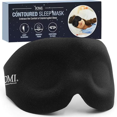 Black contoured sleep mask with DMI branding and packaging in the background.