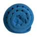 A blue foam sleeping pillow with a textured, porous sponge surface, shown rolled up against a plain white background.