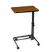 Adjustable height table with wooden top and black metal base on a white background