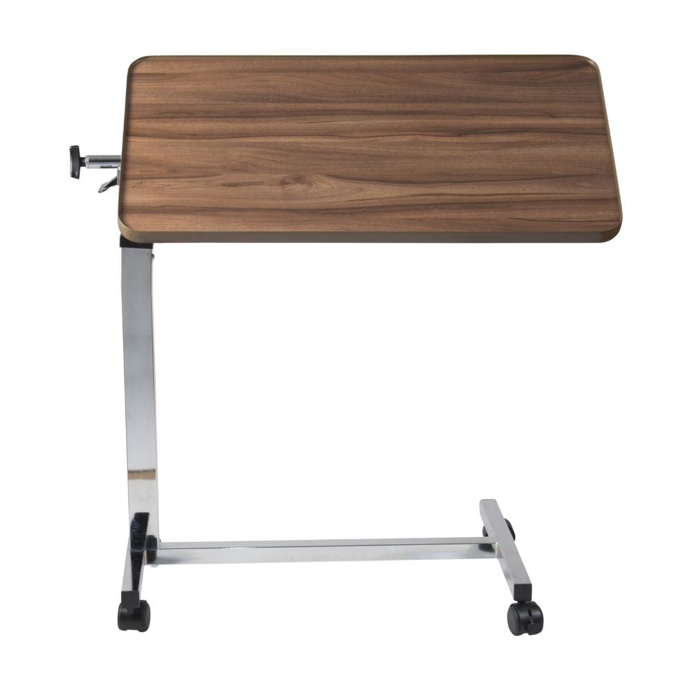 Wooden overbed table with adjustable height on a white background