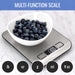 Multi-function scale with a bowl of blueberries on a white background