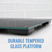 Durable tempered glass platform on a white tiled floor