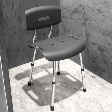 Gray shower chair with backrest on a tiled floor