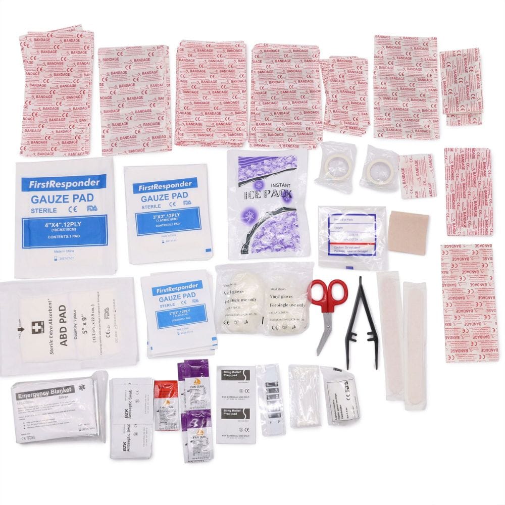 First aid kit with various components on a white background