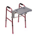Red walker with attached gray tray on a white background