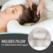 Woman receiving a head massage with a pillow for added support, close-up of the pillow shown.