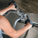 Person using a resistance band exercise machine with blurred background