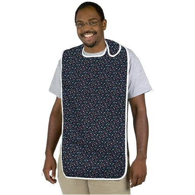 Man wearing a navy floral apron over a white shirt on a white background